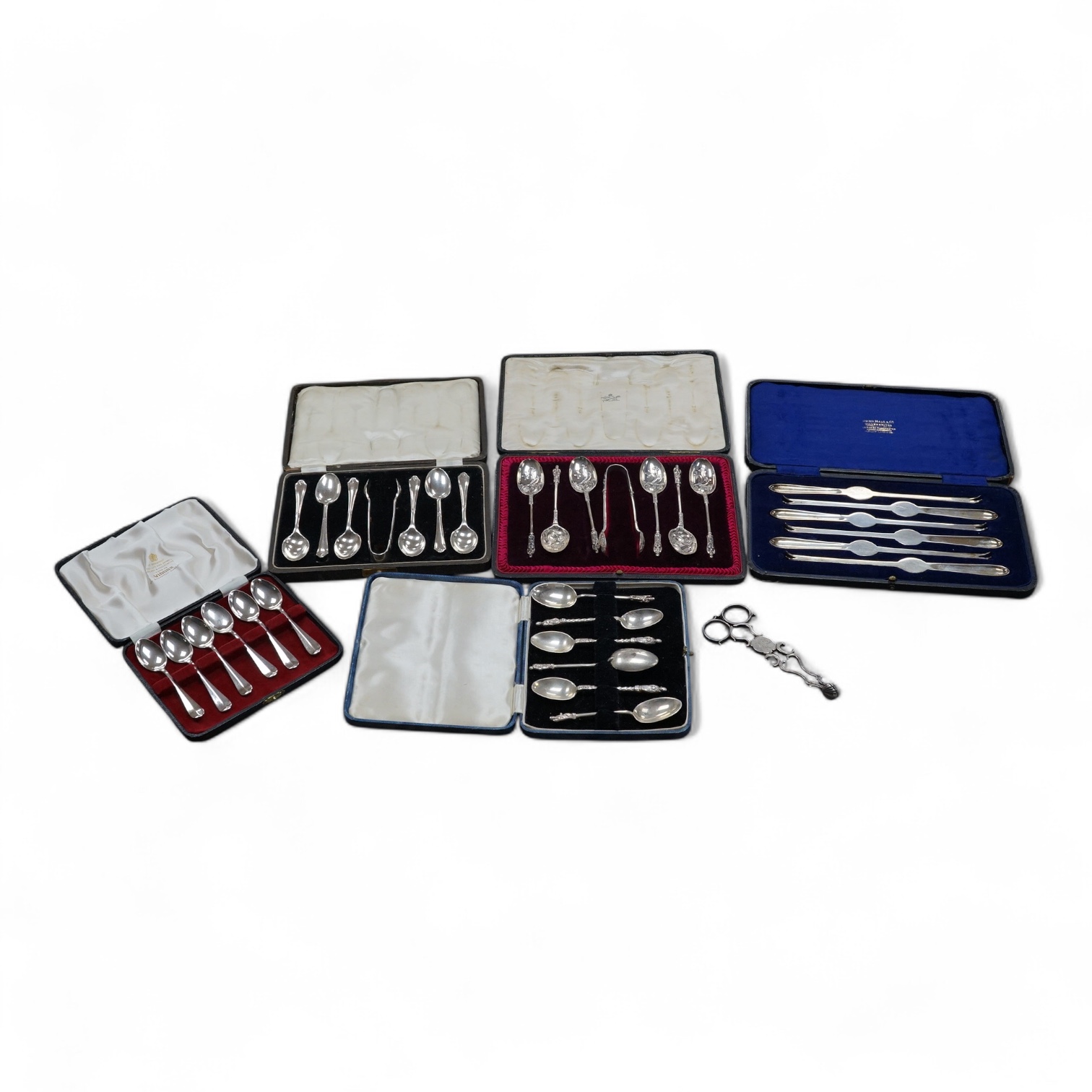 Five assorted cased sets of silver flatware including coffee spoons, teaspoons with sugar tongs and lobster picks, together with a pair of mid 18th century silver sugar nips. Condition - fair to good